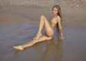 Young-skinny-babe-with-hairy-pussy-walks-naked-on-the-beach-14.jpg