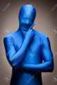 8176832-Thinking-Man-with-Hand-on-Chin-Wearing-Full-Blue-Nylon-Bodysuit-on-a-Grey-Background--Stock-Photo.jpg