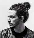A-photograph-of-a-male-model-with-the-perfect-man-bun-hairstyle-for-his-long-wavy-hair.jpg