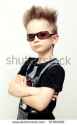 stock-photo-portrait-of-funny-kid-wearing-sunglasses-against-a-white-background-97368209.jpg
