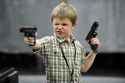 kid with guns.jpg