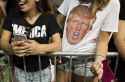 A woman wears a shirt with the likeness of Donald Trump, 2016 Republican presidential nominee. (Photographer Ty WrightBloomberg).jpg