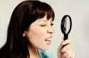 stock-photo-57991960-time-for-optometrist-visit-pretty-brunette-squints-through-magnifying-glass.jpg