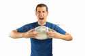64447839-loser-angry-and-aggressive-player-football-holding-the-damaged-soccer-football-on-white-background-w.jpg