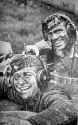 German Wehrmact Soldiers Smiling in the Mud.jpg