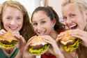 girls-eating-burger[1].jpg