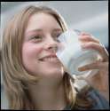 teenage-girl-drinking-a-glass-of-milk-damien-lovegrove.jpg