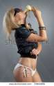 stock-photo-beautiful-sexual-girl-blonde-pose-on-gray-background-70604869.jpg