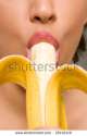 stock-photo-young-woman-eating-banana-25112419.jpg