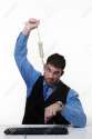 13916899-man-working-at-his-desk-with-a-hangmans-noose-around-his-neck-Stock-Photo.jpg