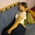Mal Malloy white shirt and jeans laying on side hair brushed back from neck.jpg
