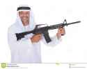 happy-mature-islamic-man-holding-gun-over-white-background-34953977.jpg