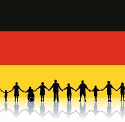 Flagge-von-Deutschland-Leute-stehen-zusammen-Haende-halten.jpg